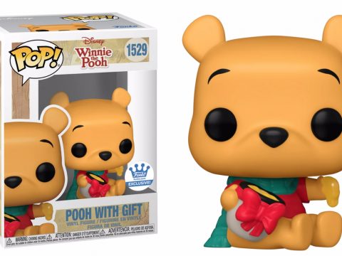 Winnie l'ourson revient pour les fêtes avec une tenue rouge et verte, et un nœud papillon sur son pot de miel.